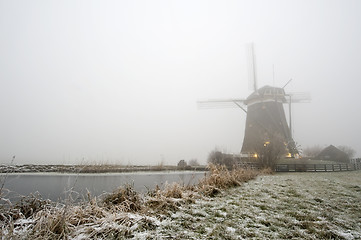 Image showing Windmill on a foggy winter morning