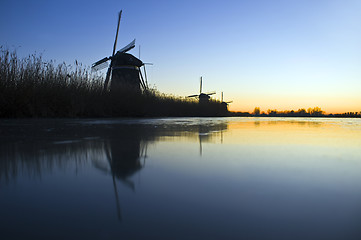 Image showing Thee windmills in Wintertime