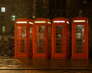 Image showing Phone boxes at night