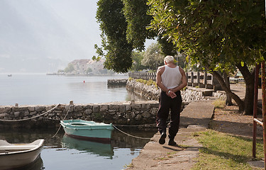 Image showing Fisherman walking