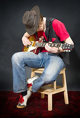 Image showing Sitting Guitar player