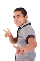 Image showing Young latin man with thumbs raised as a sign of victory
