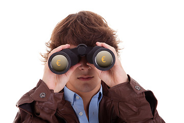 Image showing Young man looking through binoculars, with symbol of money