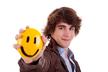 Image showing man with a yellow smile face on hand