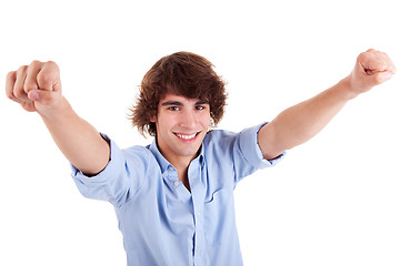 Image showing Portrait of a very happy  young man with his arms raised