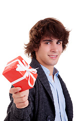 Image showing happy young man, with a red gift