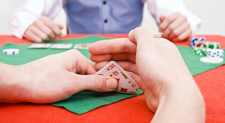 Image showing Peeking at cards