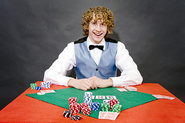 Image showing Smiling poker dealer