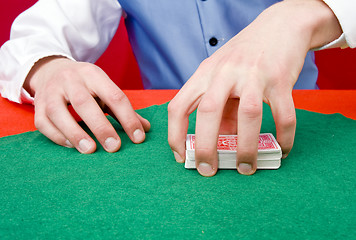 Image showing Grabbing a deck of cards