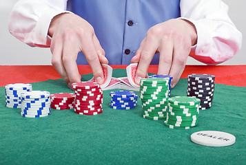 Image showing Smiling poker dealer