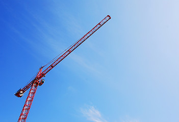 Image showing red tower crane blue sky