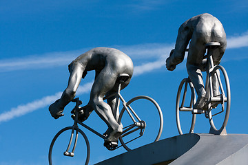 Image showing Two cyclists and their muscles