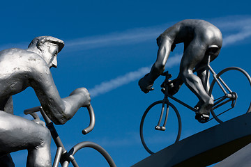 Image showing Two cyclists climbing