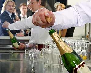 Image showing Opening a bottle of Champagne