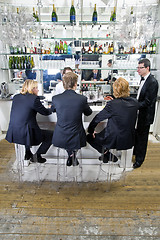 Image showing people sitting at a bar