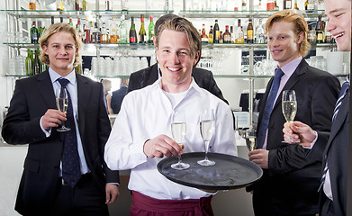 Image showing waiter serving champagne