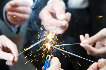 Image showing Igniting spark sticks