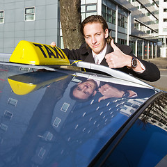 Image showing Smiling taxi driver