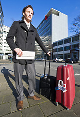 Image showing Businessman waiting for a taxi