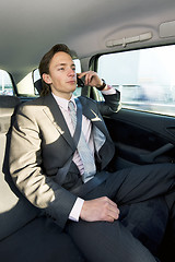 Image showing backseat business call