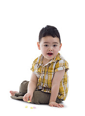 Image showing cute boy with candies