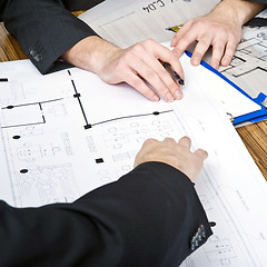 Image showing Discussing architectural plans