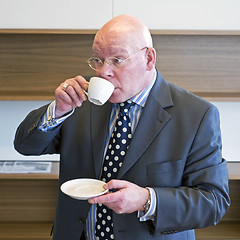 Image showing Sipping coffee