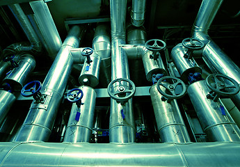 Image showing different size and shaped pipes and valves at a power plant
