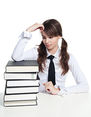 Image showing Sad schoolgirl with books