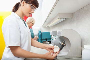 Image showing Dental Assistant with Tooth Impression