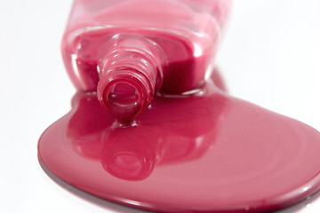 Image showing Nail Polish Spilling on a Mirror