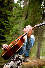 Image showing Woman Singing Free in the Forest