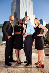 Image showing Four Business People Looking Upwards