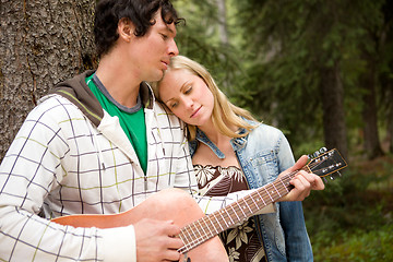 Image showing Man Playing Guitar Outdoor