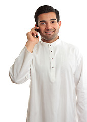 Image showing Smiling man using phone