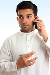 Image showing Ethnic business man using phone