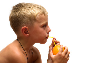 Image showing Child with an orange.