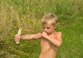 Image showing Child with a slingshot.