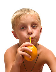 Image showing Child with an orange.