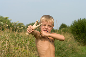 Image showing Boy with a slingshot.