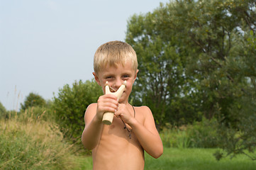 Image showing Boy with a slingshot.