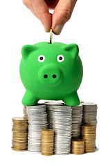 Image showing Green Piggy Bank and Coins