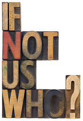 Image showing if not us, who - question in wood type