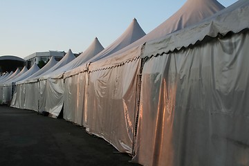 Image showing Tents lined up in a row