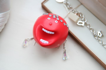 Image showing red nose and wedding jewellery