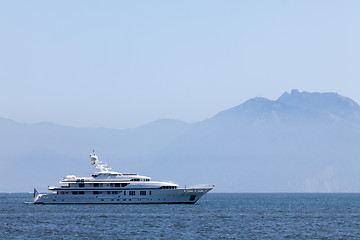 Image showing Cruising yacht in the sea on the background of mountains