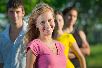 Image showing The girl and her friends in the park