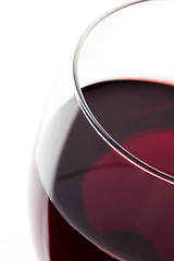 Image showing A glass of red wine. Detail on white