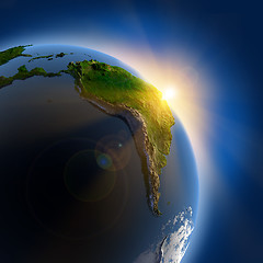 Image showing Sunrise over the Earth in outer space