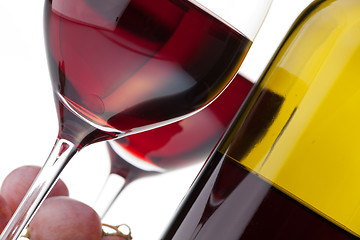 Image showing Two glasses with dark red wine on a white background
